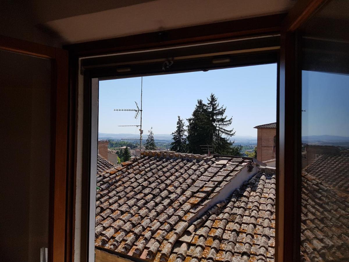 Un Terrazzo Sulla Magia Apartment Siena Bagian luar foto