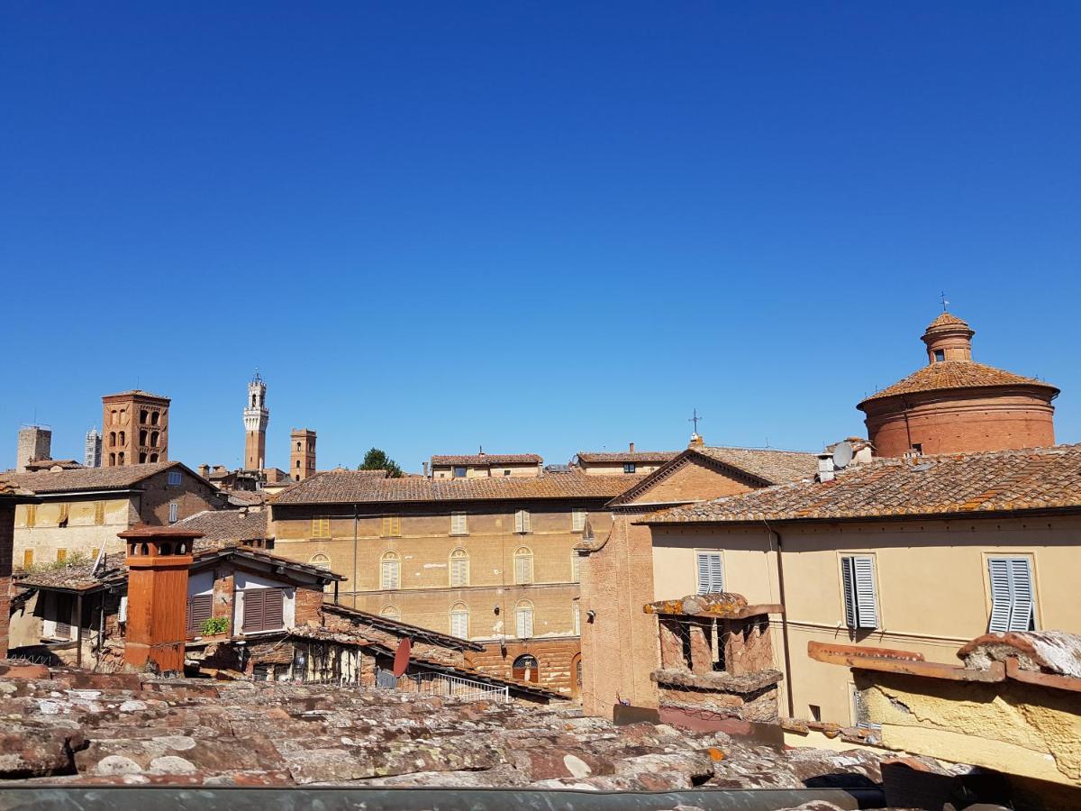 Un Terrazzo Sulla Magia Apartment Siena Bagian luar foto